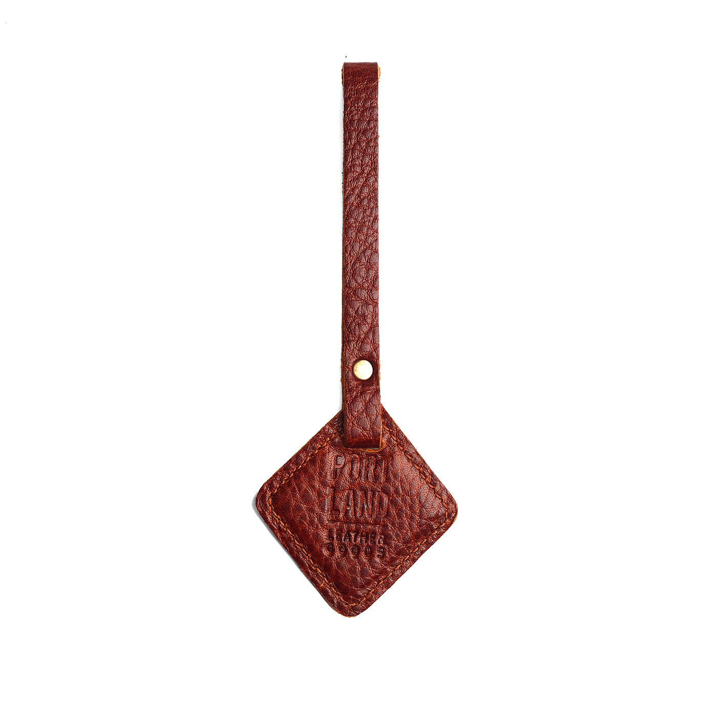 Nutmeg | Rhombus-shaped leather tag with a strap and debossed PLG design