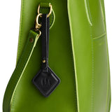 Pebbled--black | Rhombus-shaped leather tag with a strap and debossed PLG design hanging from a green leather bag