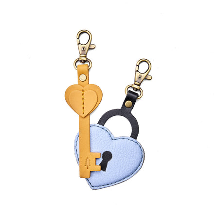 Skyway | Two leather key and heart lock shaped keychains with swivel lobster claw clasps