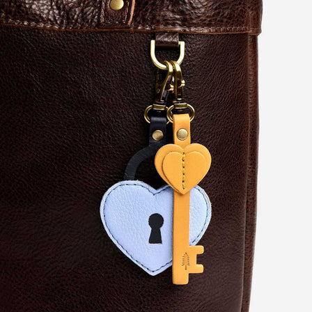 Skyway | Two leather key and heart lock shaped keychains with swivel lobster claw clasps