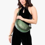Metallic Greench | Model wearing half circle shaped sling bag