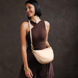Moonflower Large | Model wearing half circle shaped sling bag