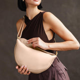 Moonflower Large | Model wearing half circle shaped sling bag