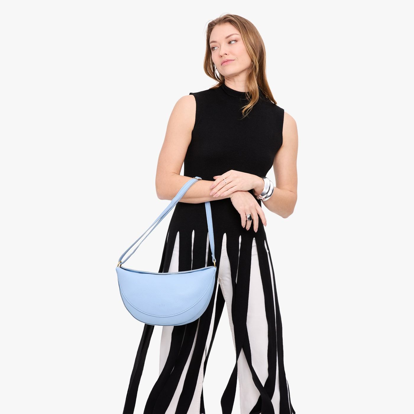 Skyway*Large | Model wearing half circle shaped sling bag
