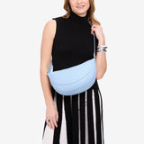 Skyway Large | Model wearing half circle shaped sling bag