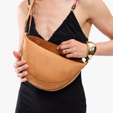 Desert Flower |  Model wearing half circle shaped sling bag
