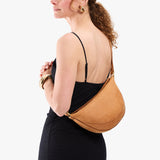 Desert Flower |  Model wearing half circle shaped sling bag
