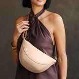 Moonflower Medium | Model wearing half circle shaped sling bag