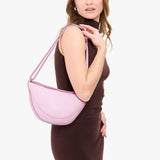 Pinkaboo Medium | Model wearing half circle shaped sling bag