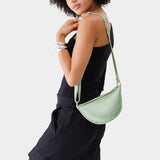 Beetle Small | Model wearing half circle shaped sling bag