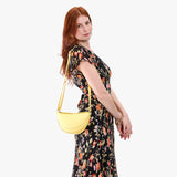 Butter Bliss Small | Model wearing half circle shaped sling bag