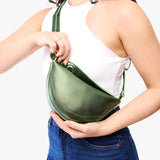 Metallic Greench Small | Model wearing half circle shaped sling bag