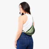 Metallic Greench Small | Model wearing half circle shaped sling bag