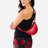 Reba Red Small | Model wearing half circle shaped sling bag