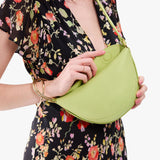 Shadow Lime Small | Model wearing half circle shaped sling bag