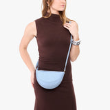 Skyway Small | Model wearing half circle shaped sling bag