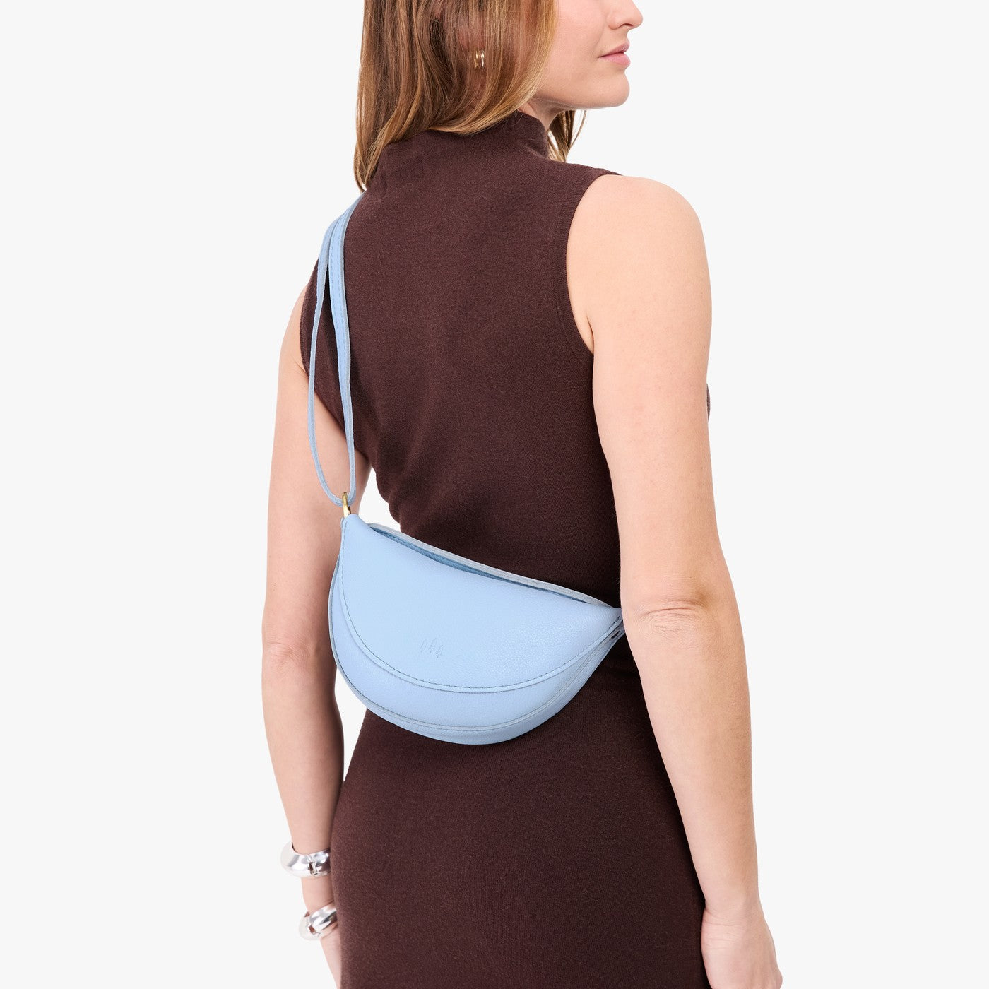 Skyway*Small | Model wearing half circle shaped sling bag