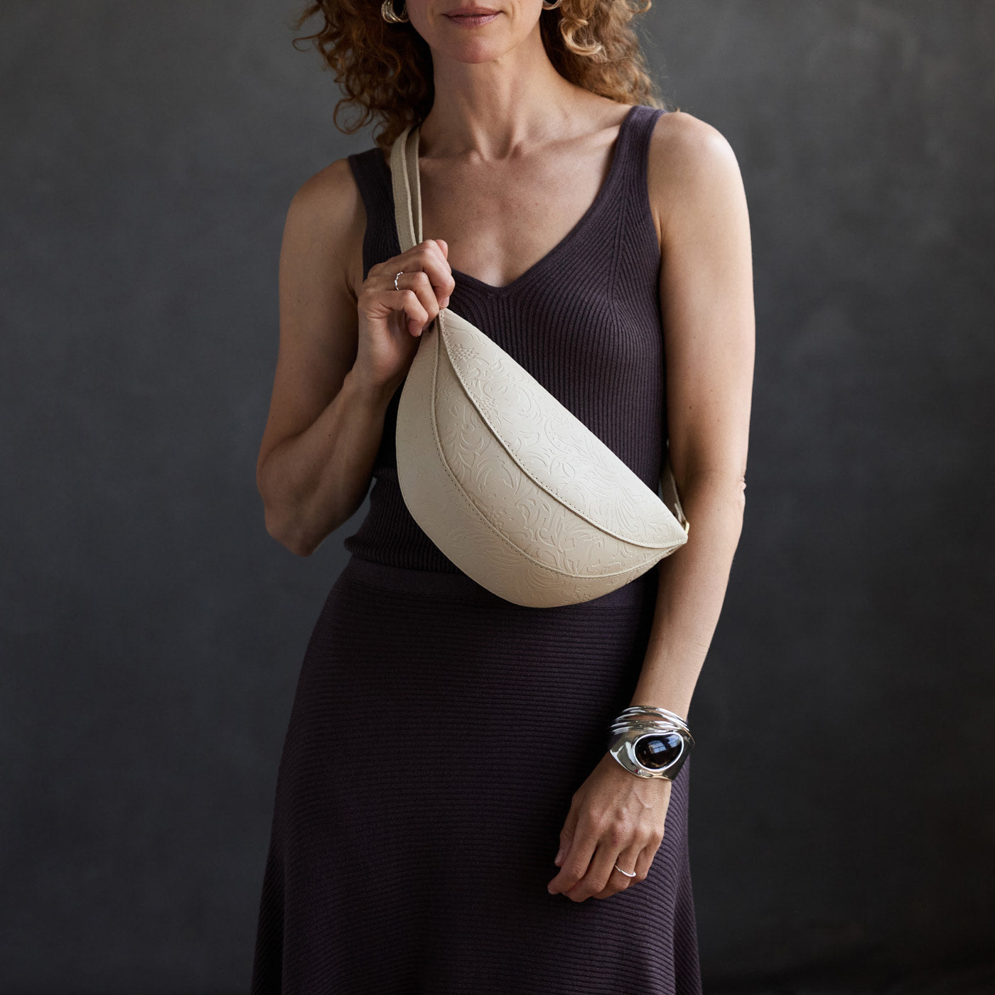 Jasmine |  Model wearing half circle shaped sling bag