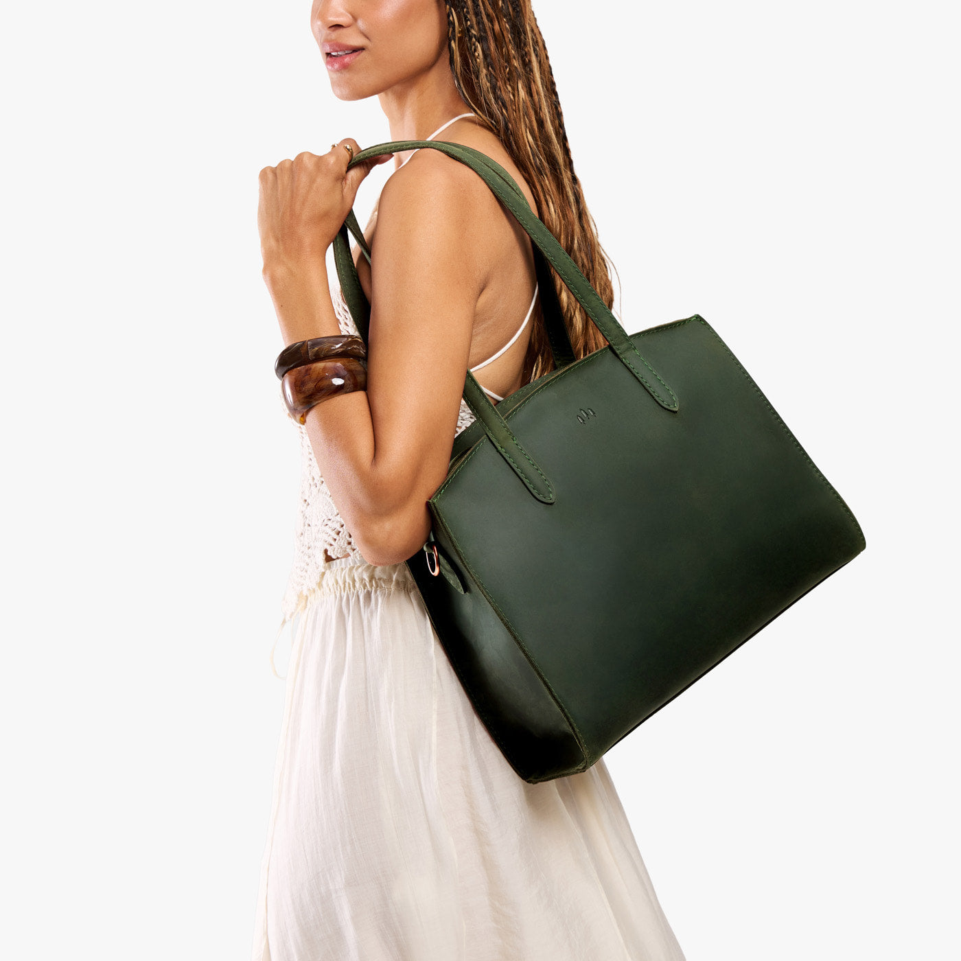 Evergreen*Large | Model carrying leather tote bag with handles, adjustable crossbody strap, and two back pockets