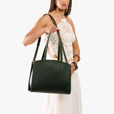 Evergreen Large | Model carrying leather tote bag with handles, adjustable crossbody strap, and two back pockets