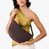 Moose Large | Model wearing petite half circle shaped sling bag