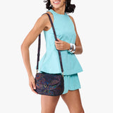 Carnival Large | Model wearing a leather Crossbody with a flap and magnetic closure