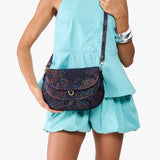 Carnival Large | Model wearing a leather Crossbody with a flap and magnetic closure
