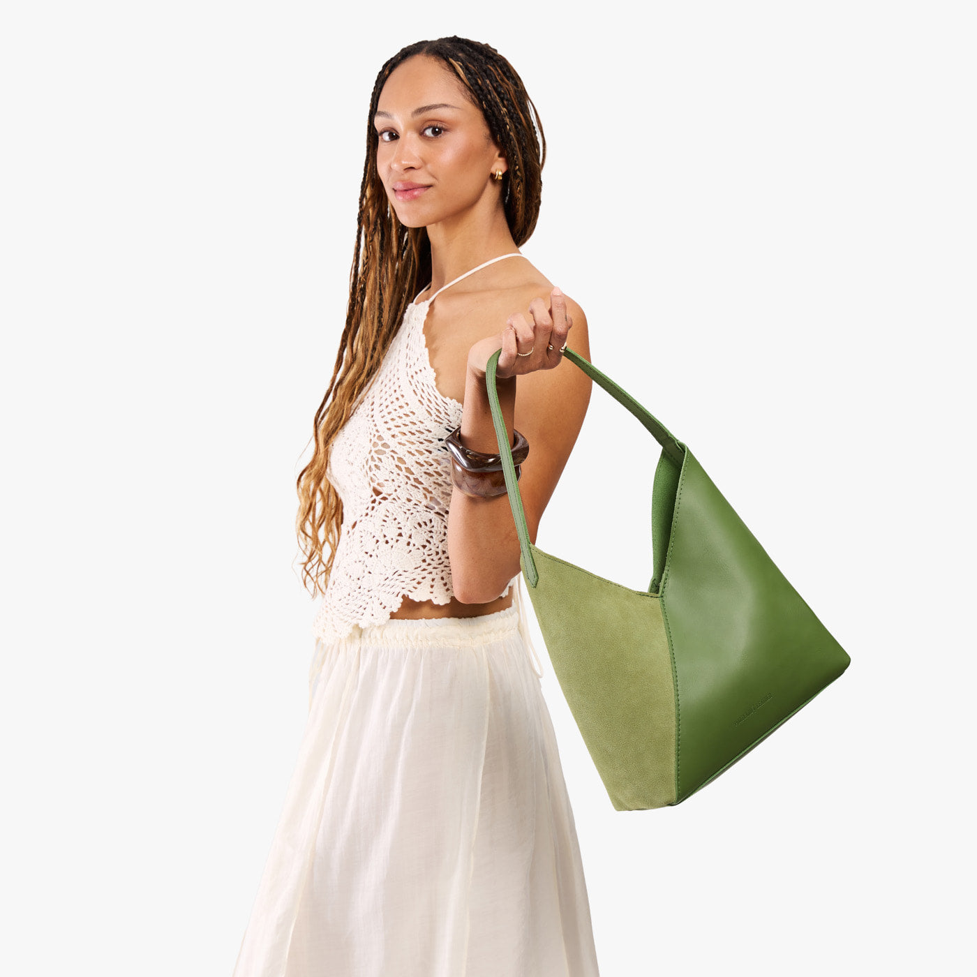 Dryland Green*Large | Model holding mid-size shoulder bag with magnetic snap closure