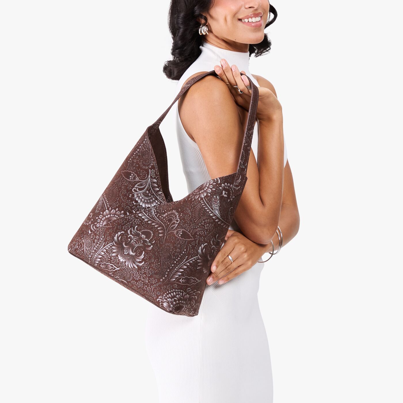 Sepia*Large | Model holding mid-size shoulder bag with magnetic snap closure