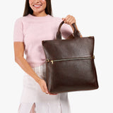 Coldbrew Large | Model wearing a convertible tote clutch crossbody