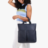 Night Owl Large | Model wearing a convertible tote clutch crossbody