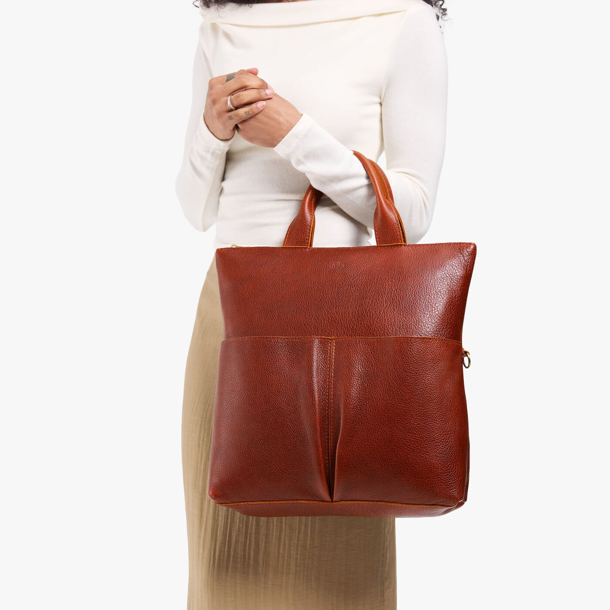Nutmeg*Large | Model wearing a convertible tote clutch crossbody