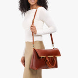 Nutmeg Large | Model wearing a convertible tote clutch crossbody