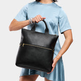 Pebbled--black Large | Model wearing a convertible tote clutch crossbody
