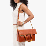 Sienna Large | Model wearing a convertible tote clutch crossbody