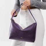 Empire Large | Medium sized slouchy leather shoulder bag with zipper opening and three metal tree emblems