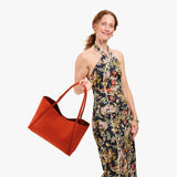 Paprika Large | Model holding midsize rectangular tote bag