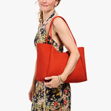 Paprika Large | Model holding midsize rectangular tote bag