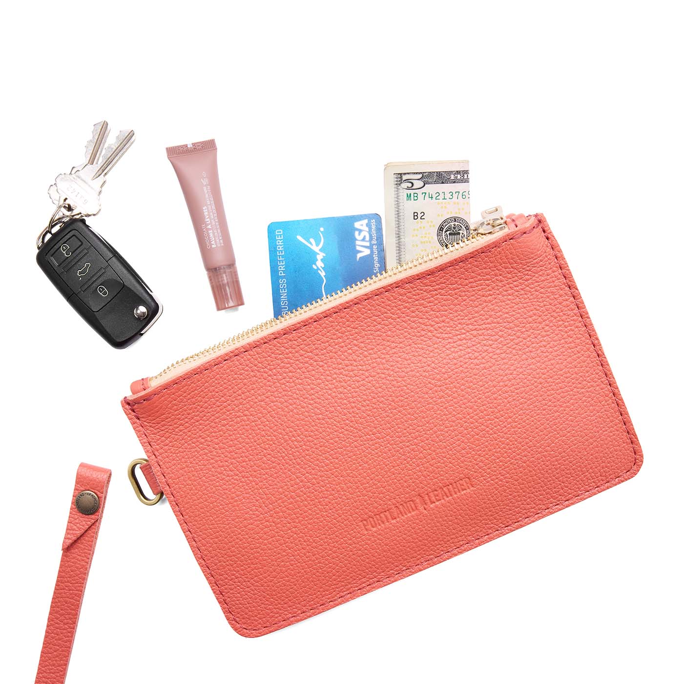 Coral | Leather wristlet with two zippered pockets and removable wrist strap