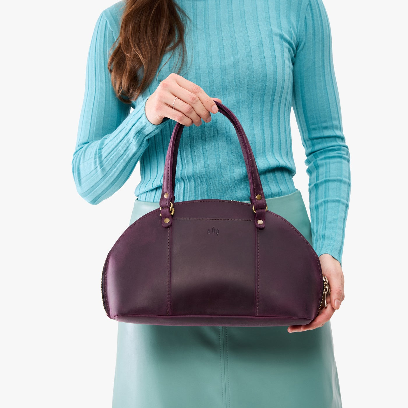 Larkspur*Small | Model holding a half circle crossbody bag with handles and removable crossbody strap 