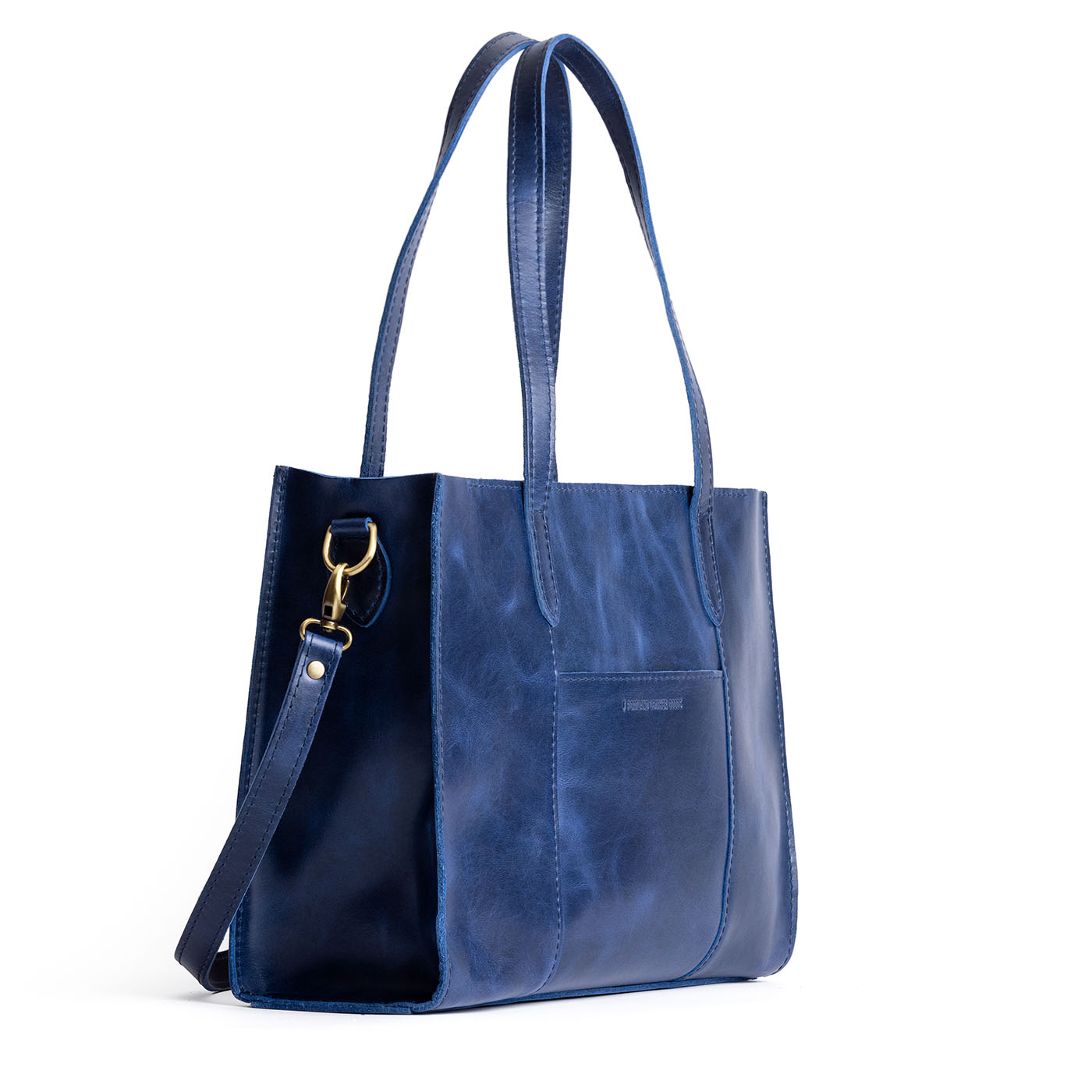 Cowboy Blue*East/West | Structured wide tote bag with overlapping panels and crossbody strap