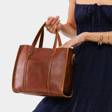 Nutmeg | Structured mid-size tote bag with overlapping panels and crossbody strap