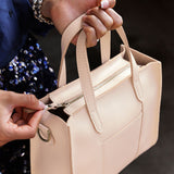 Moonflower Zipper | Structured mid-size tote bag with overlapping panels and crossbody strap