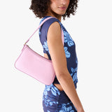 Pinkaboo | Model carrying petite bean shaped shoulder bag with a zipper closure
