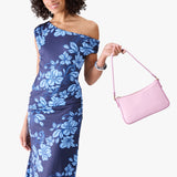 Pinkaboo | Model carrying petite bean shaped shoulder bag with a zipper closure