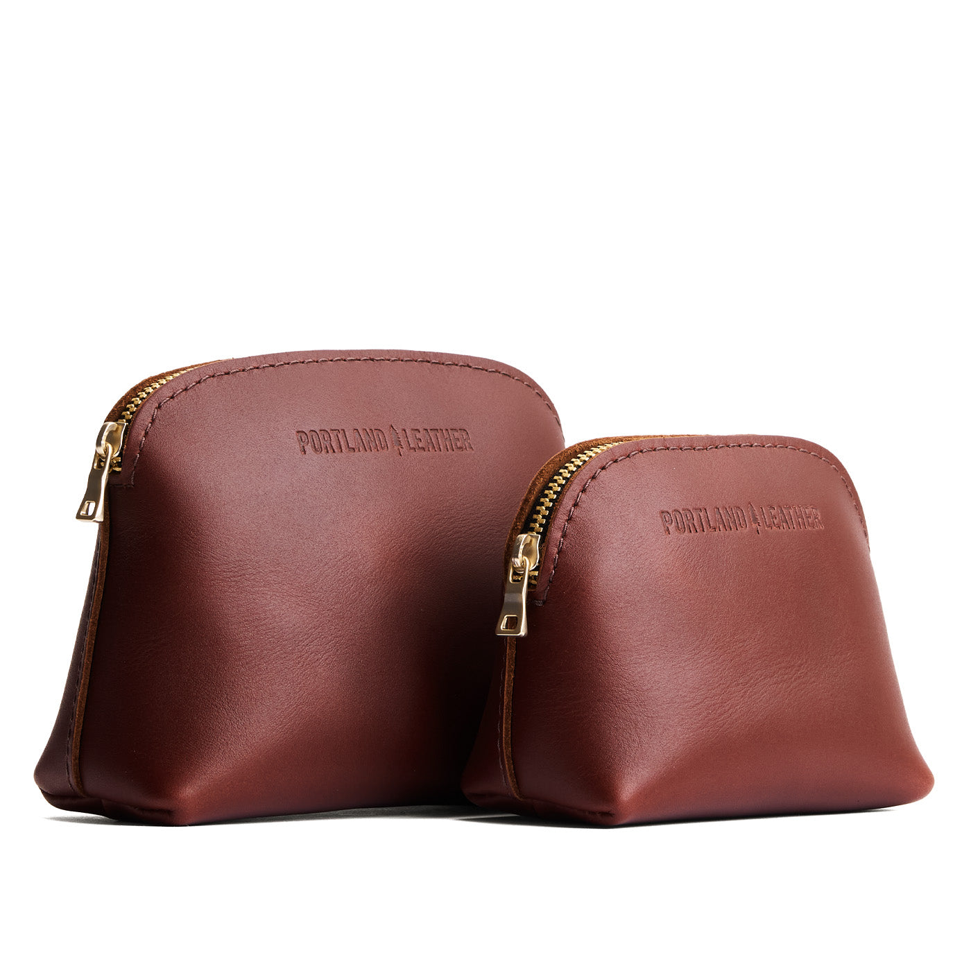 Cognac | Comparison view of compact leather pouches with top zippers