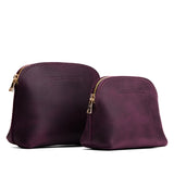 Larkspur | Comparison view of compact leather pouches with top zippers