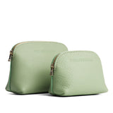 Pistachio | Comparison view of compact leather pouches with top zippers