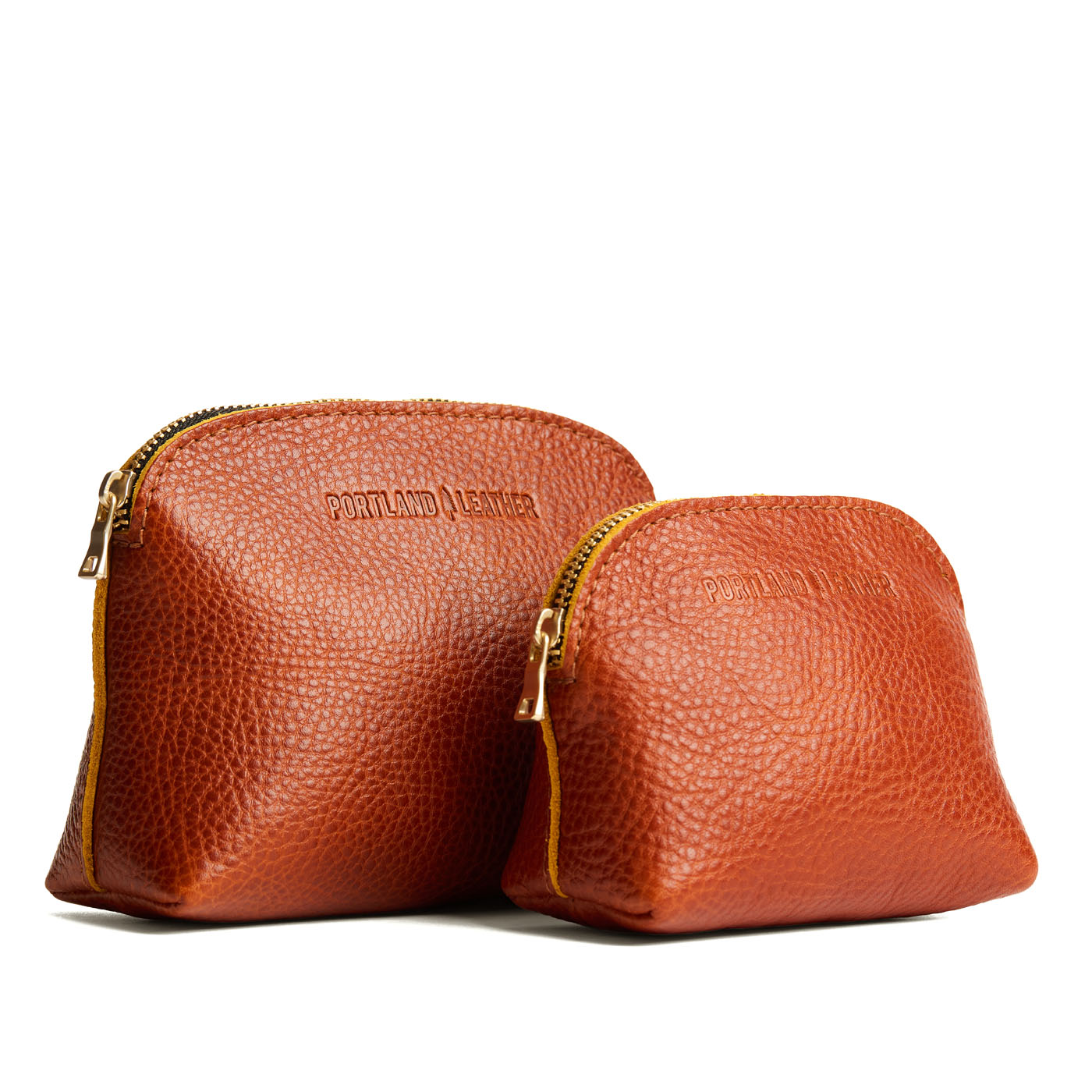 Sienna | Comparison view of small and large compact leather pouches with top zippers