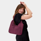 Superbloom Large | U-shaped, flat-bottomed leather shoulder bag with two outside pockets